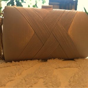 Clutch purse. Champagne color with gold accents.